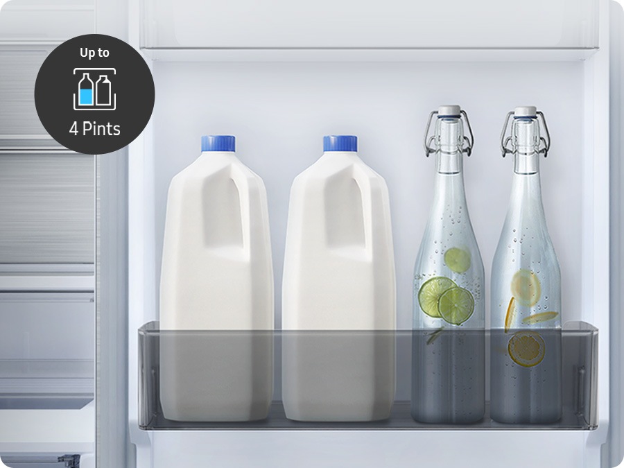 Two bottles of milk and two bottles of water are stuck in the RB7300 Big Door Bin. There is Up to 4 Pints icon.