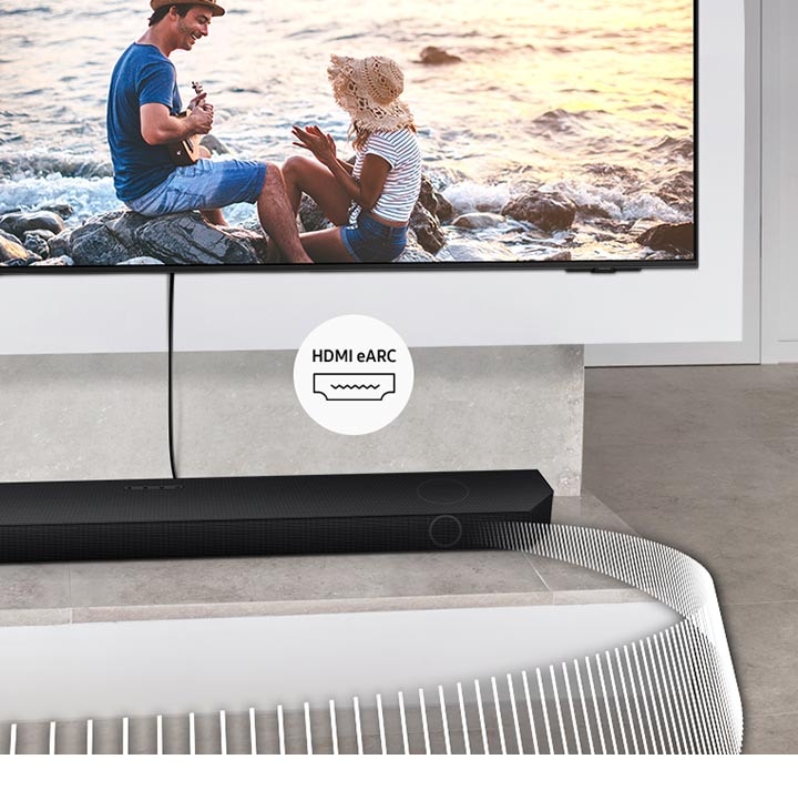 Soundbar přehrává zvukové vlny z televizoru připojeného kabelem. Přiložený štítek označuje HDMI eARC.