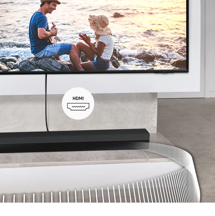 Soundbar Samsung je připojen k televizoru kabelem. Přiložený štítek označuje HDMI.