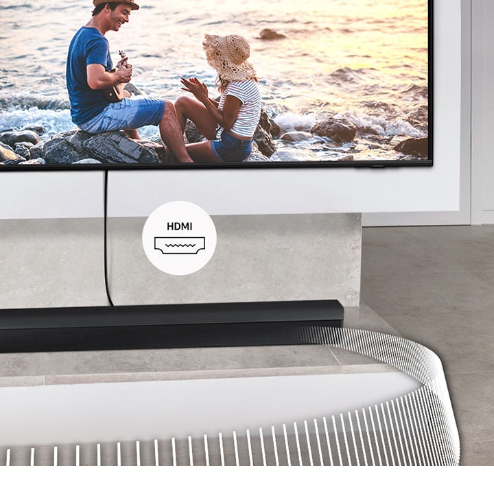 Soundbar Samsung je připojen k televizoru kabelem. Přiložený štítek označuje HDMI.