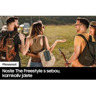 People are at a wide outdoor area in casual clothing chatting with eachother. The Freestyle Case is hanging on the woman's bag.