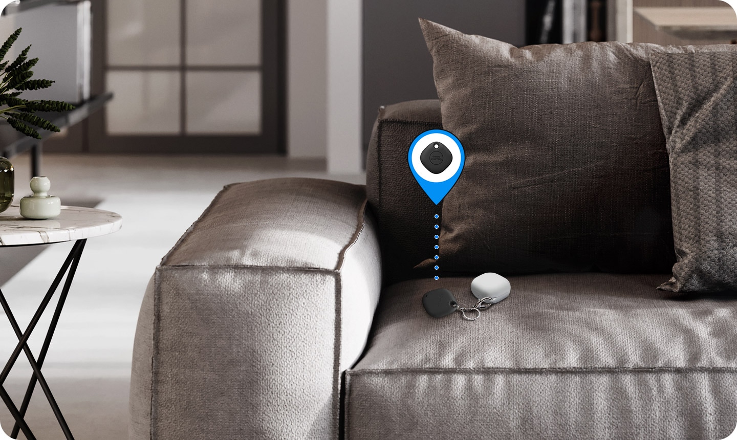 On a sofa, Galaxy Buds in the corner is seen with SmartTag+ attached. Virtual icon indicates that tag helps users find items.