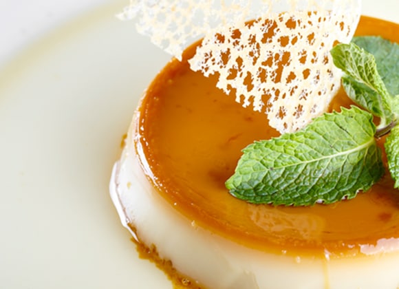 Shows a Crème Caramel dessert, which can made at home in the microwave oven using the Home Dessert option.