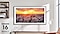 The Frame is hanging on a wall in a living room displaying a sunset over a city.