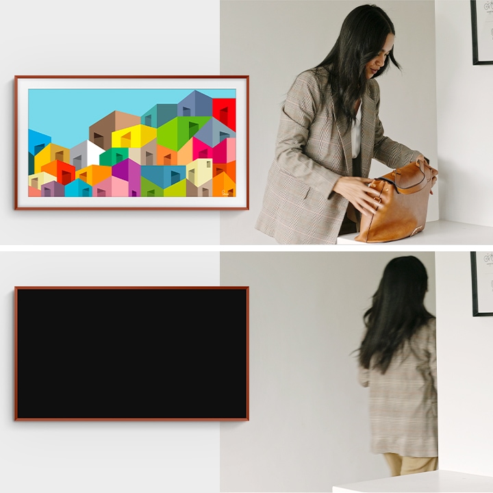 The frame is displaying a colorful artwork. A woman is next to the artwork touching her bag.