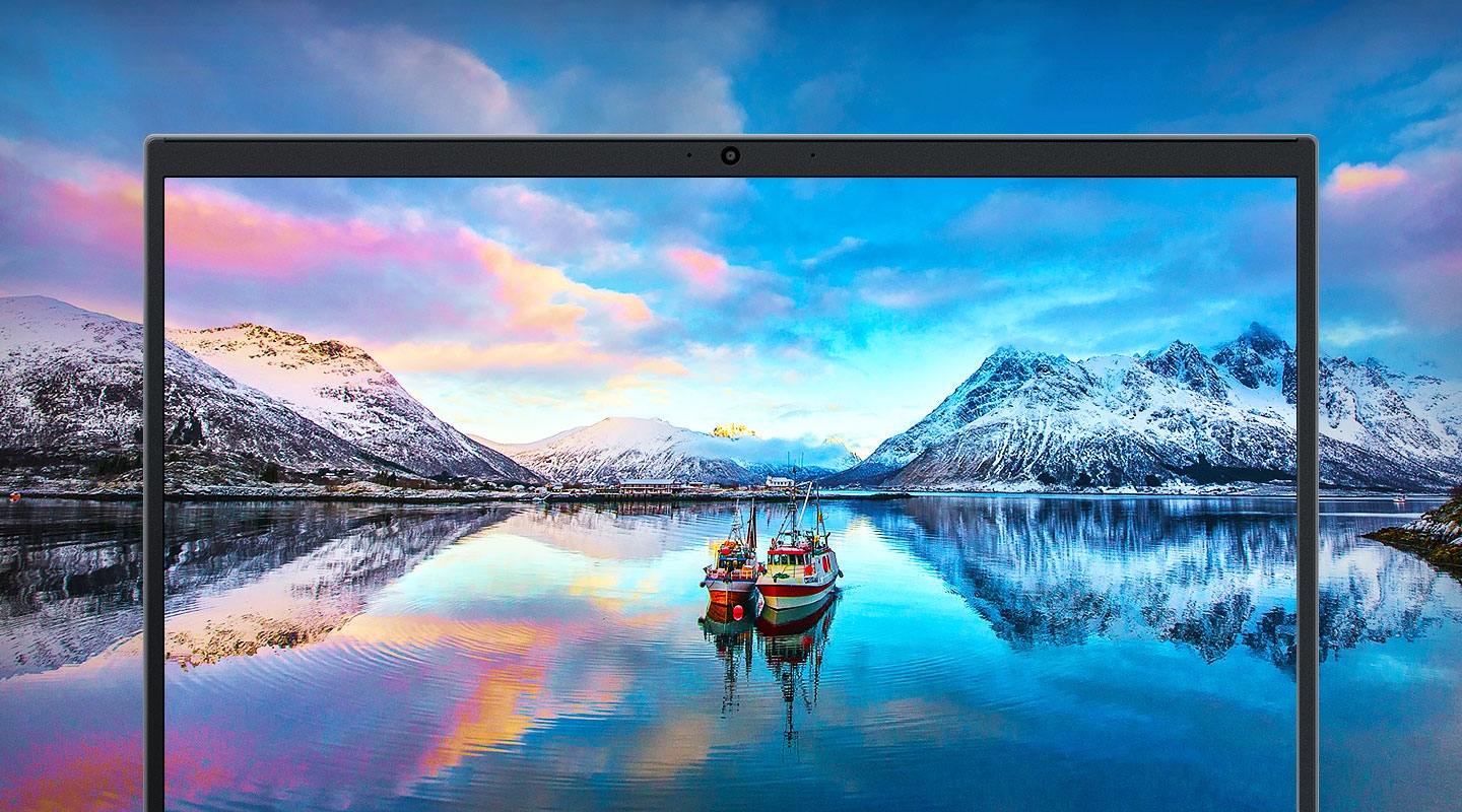 Notebook plus2's immersive display showing cinematic natural scenery with river, mountains and boat in blueish background