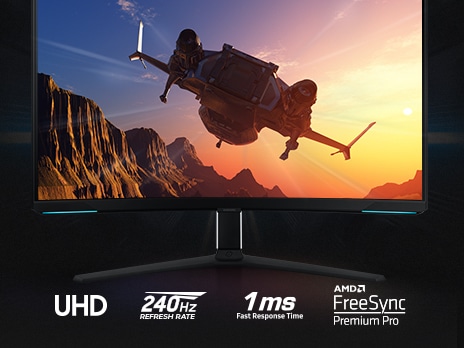 On the monitor display which is front facing, an aircraft is flying toward the sun over a mountain landscape. Underneath the stand of the monitor are four logos, demonstrating UHD resolution, 240Hz refresh rate, 1ms response time and NVIDIA G-SYNC compatibility.
