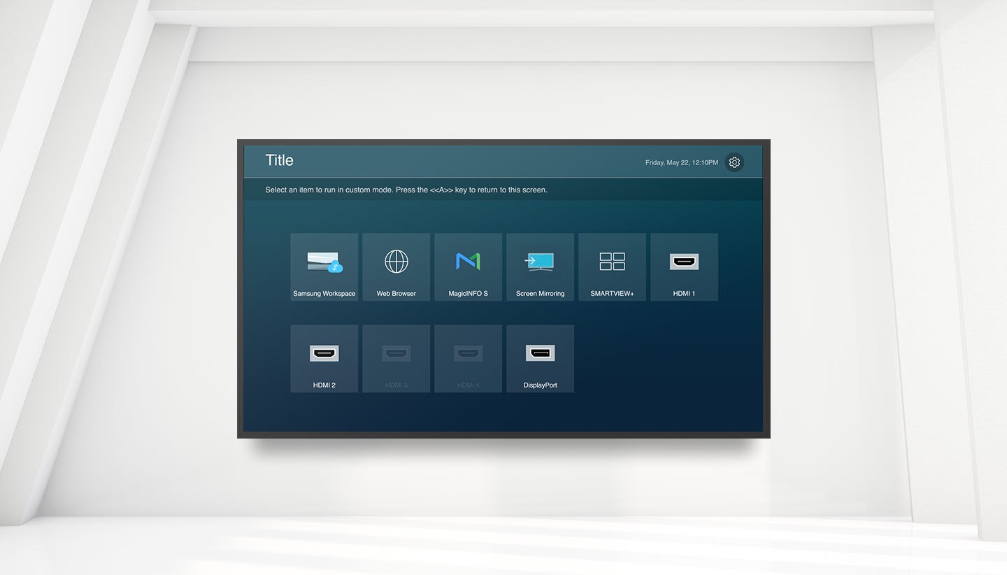 There is a custom home function screen in the QMB. Title is written on the upper left, the day and time are written on the upper right, and there is a setting icon next to it. Select an item to run in custom mode. Samsung Workspace, Web Browser, MagicINFO S, Screen Mirroring, SMARTVIEW+, HDMI 1, HDMI 2, DisplayPort features are listed with the text Press the <<A>> key to return to this screen.