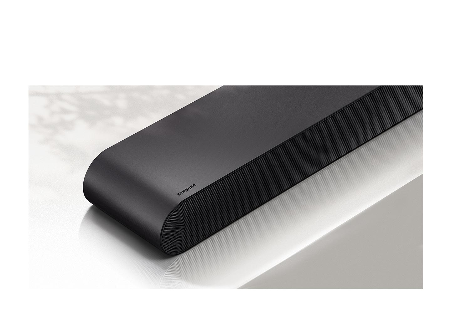 Closeup view of S50B soundbar which is shown in front with Samsung logo visible.