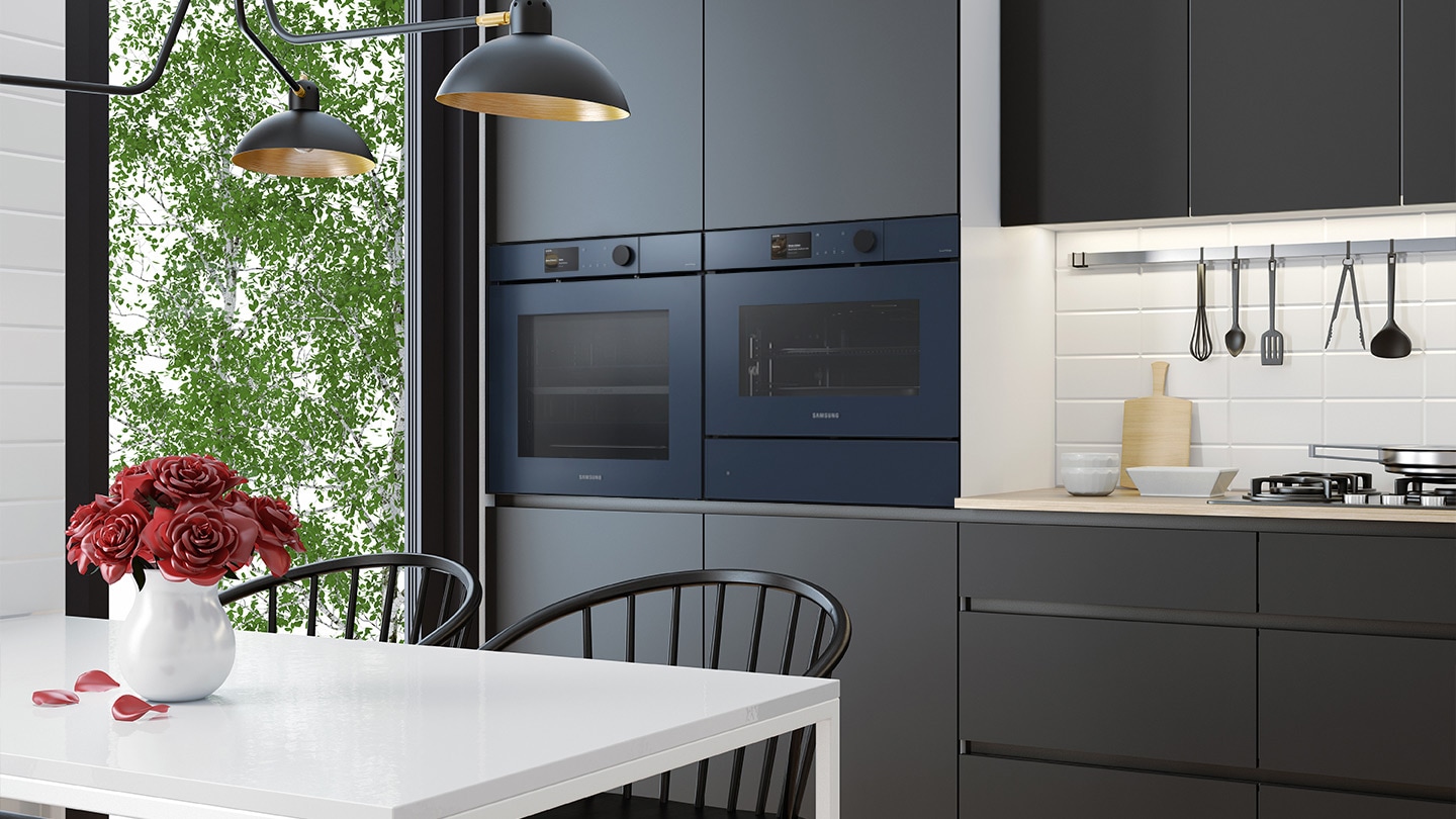Shows the built-in oven seamlessly installed in a kitchen next to a Microwave Combo oven. Its BESPOKE ""Clean Navy"" color elegantly complements and enhances the kitchen's color scheme.