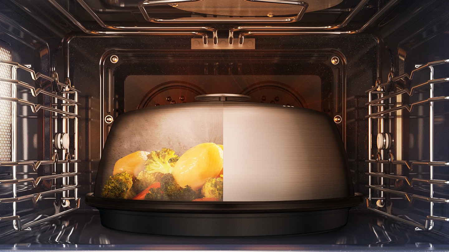 Shows the Pro Steamer inside the oven. One half of its cover is full of steam and the other half is clear to illustrate that the vegetables inside it are being steam cooked.