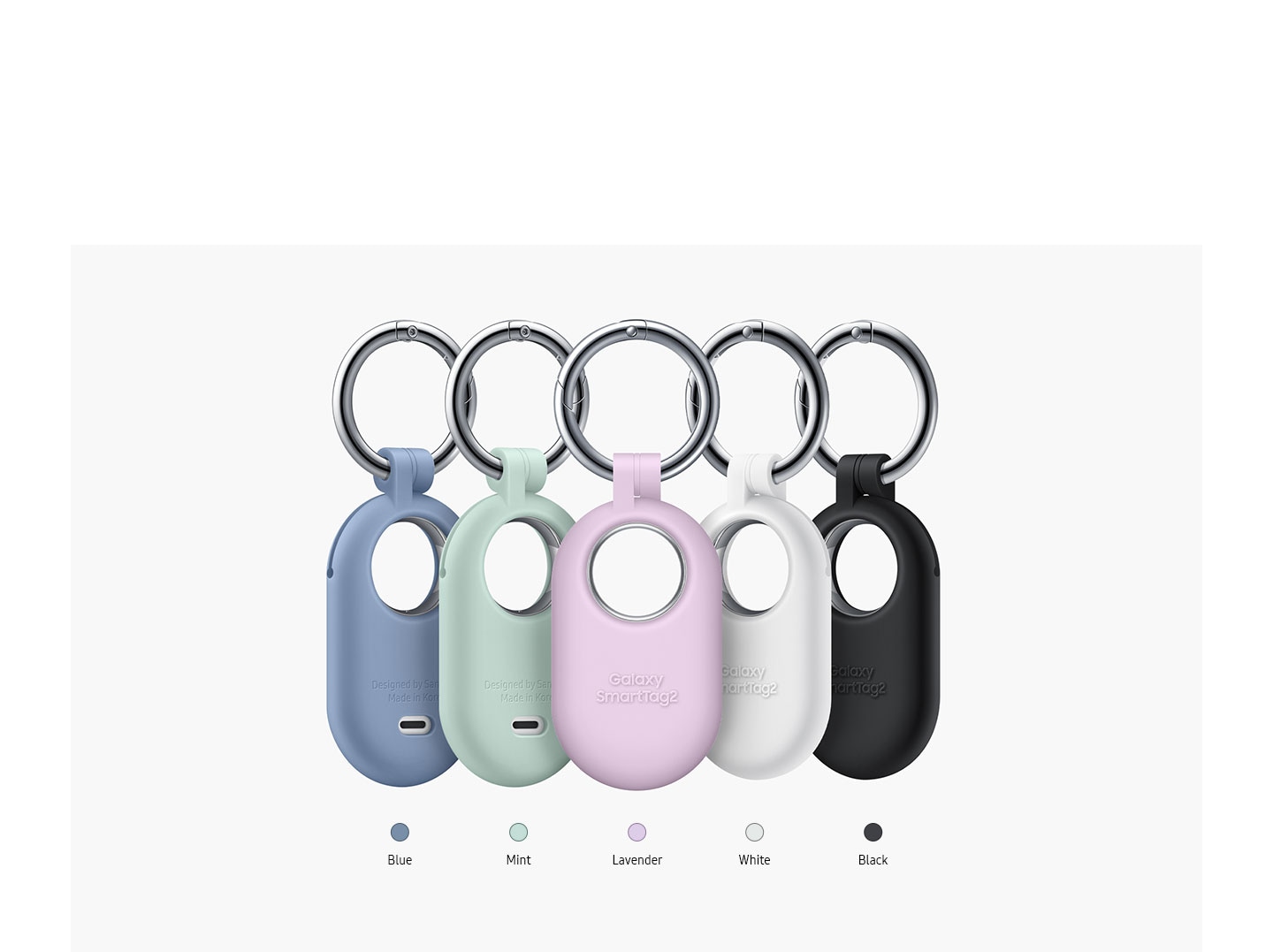 Five Galaxy SmartTag2 are in different Silicone Cases. Below each are the color chip and color name Blue, Mint, Lavender, White and Black.