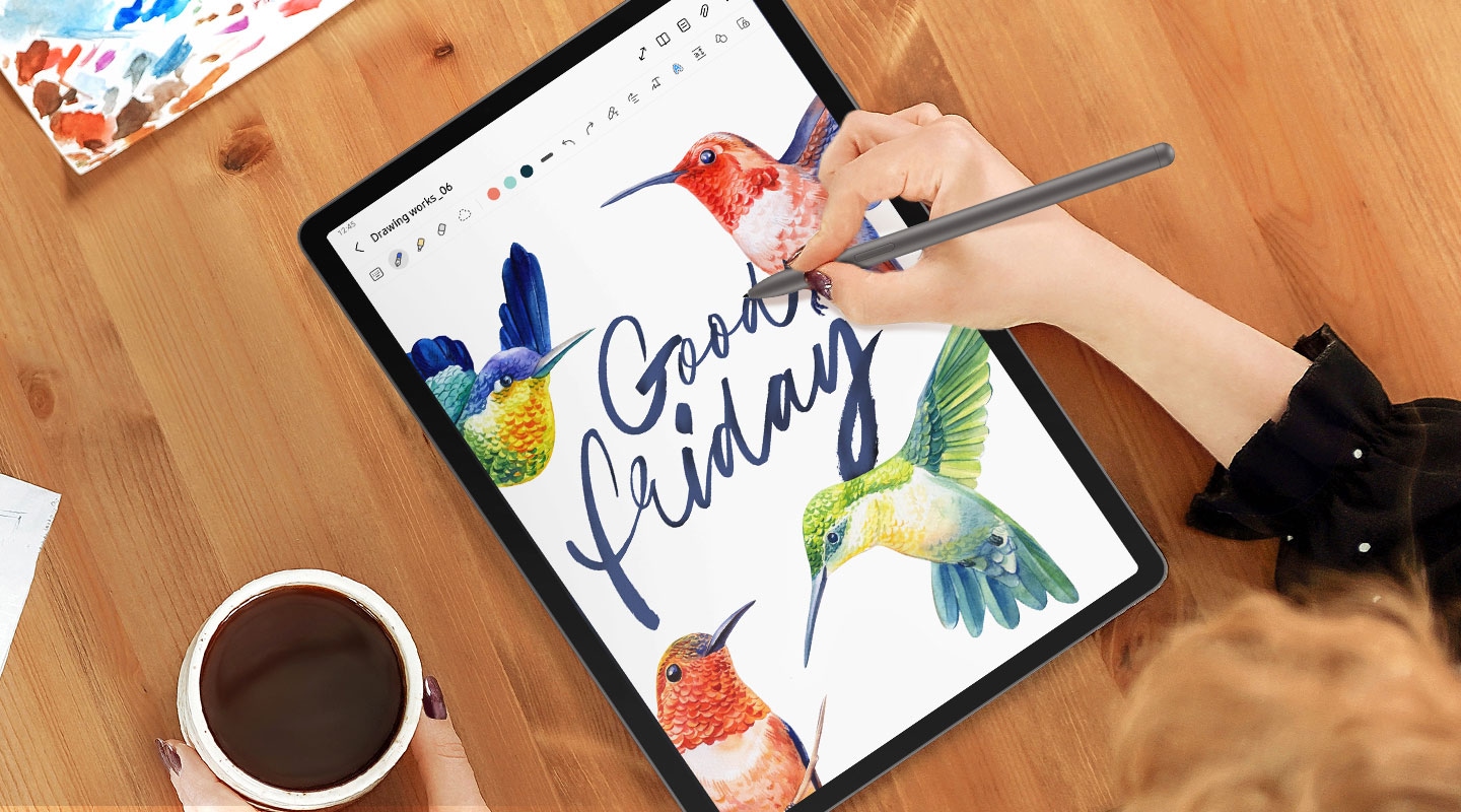 Front view of a Galaxy Tab S9 FE and Tab S9 FE+ device displaying the GoodNotes app. S Pen writes the words Good Friday in cursive above a bird illustration using the app.
