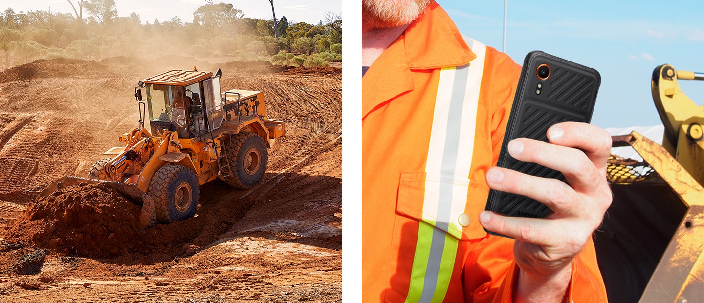 Ein Radbagger gräbt sich auf einem großen Gelände in den Boden. Ein Bauarbeiter hält auf einer Baustelle ein Galaxy XCover7 in einer Hand.