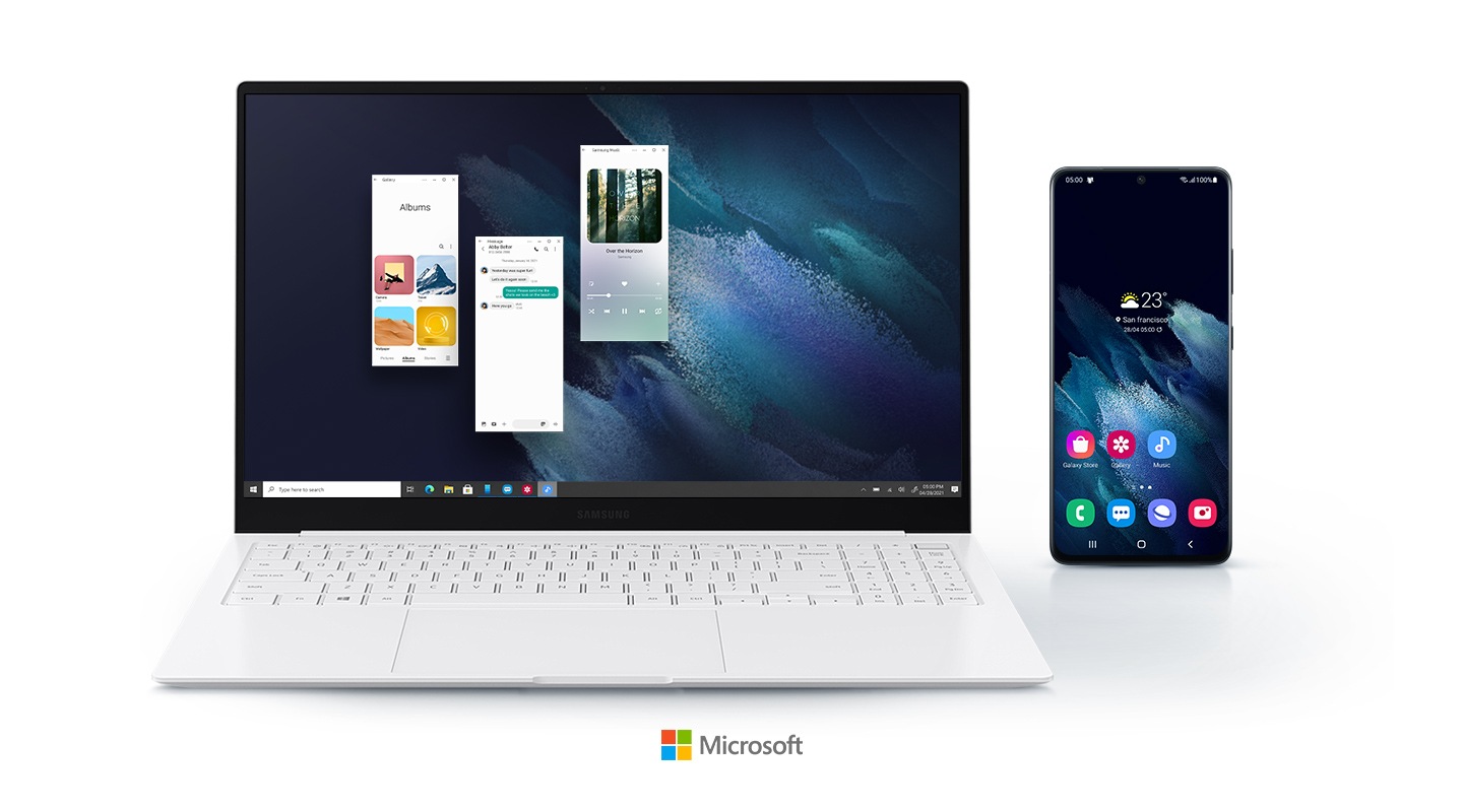 Three Android apps are being run on the Galaxy Book Pro by using Your Phone app. A mobile phone is displayed right next to the laptop, showing that the two devices are connected. A logo of Microsoft is placed below the devices.
