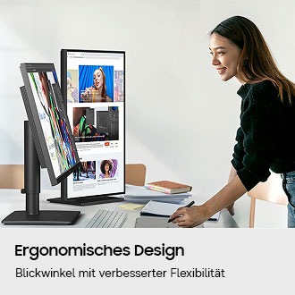 Ein Designer nutzt zwei Monitore, von denen einer geneigt und der andere um 90 Grad gedreht ist.
