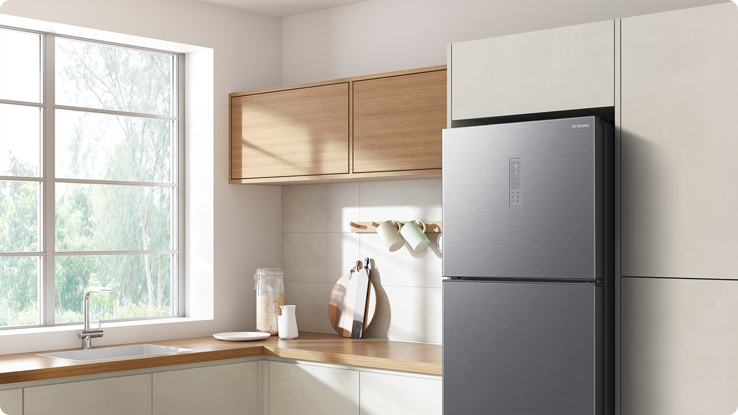 The sleek exterior of the fridge gives a clean look to the modern kitchen, with a flat finish.