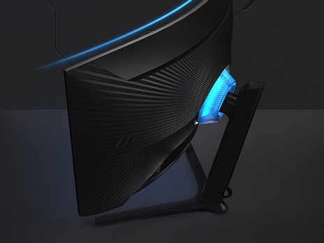 The rear of the monitor is pivoted round to the left, showing the rear infinity lighting design which is illuminated.