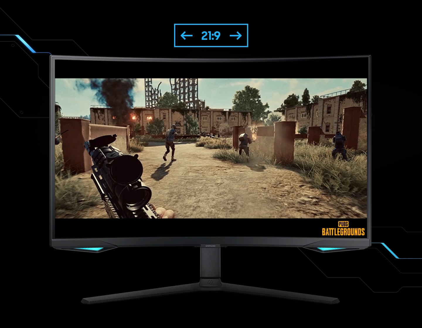 A monitor shows the viewpoint of a player within a shooting game. The player is running around a battle zone, with a machine gun. As the screen is extended from 16:9 to 21:9 proportion, an unseen enemy reveals in the left corner. ""Battleground"" logo is shown on the right lower corner of the screen.