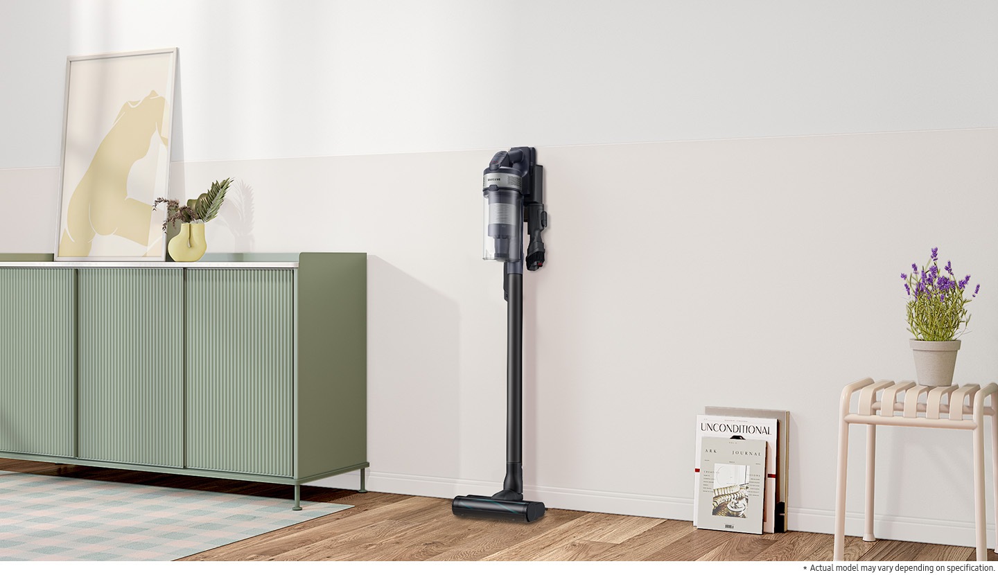 Jet 75E is standing in charging station on the wall of a modern living room. Actual model may vary depending on specification.