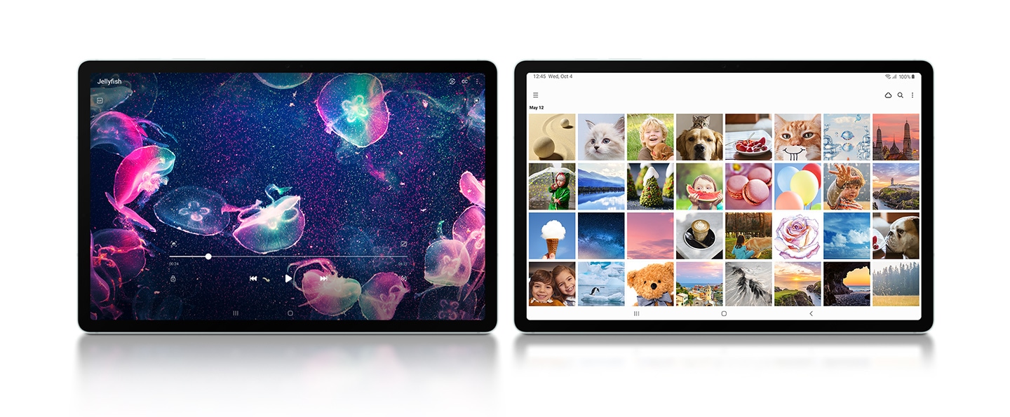 Two Galaxy Tab S9 FE+ devices in Mint placed next to each other in Landscape mode, facing forward. On the left one, a video of colorful jellyfish is playing fullscreen. On the right one, the Samsung Gallery app is open fullscreen.