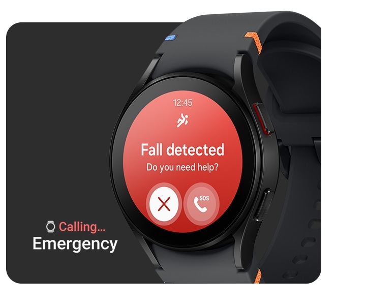 A black Galaxy Watch FE with a black stitch band is seen from the slanted left front. The watch face shows a fall detection alert with a message that says, 'Fall detected. Do you need help?' Below the message, there is a quit button and an SOS emergency call button. To the left of the watch, there is a text saying 'Calling... Emergency,' indicating the watch is making an emergency call.