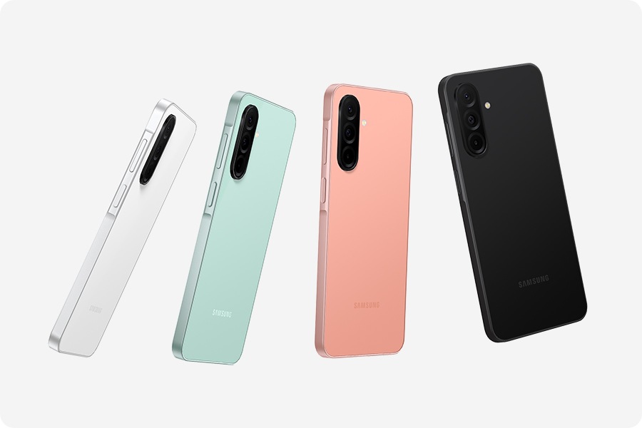 Four Galaxy A26 5G devices in White, Mint, Peach Pink and Black, showcasing their glass back featuring a 3-camera layout.