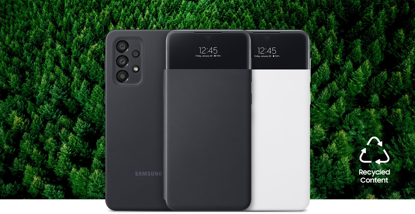 Three Galaxy A33 5G phones with the S View Wallet Covers installed. One phone is seen from the rear, and the rest are seen from the front with the case cover closed. The two seen from the front have a digital clock showing on the cover window. Background is forest. Text says Recycled Content.