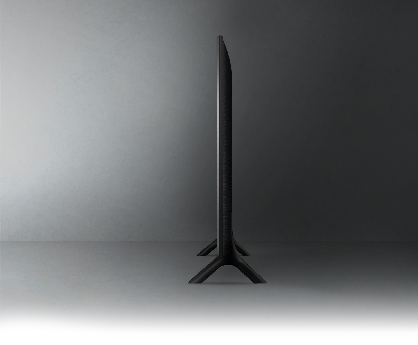 The profile view of the QLED TV shows the ultra-thin design of the QLED AirSlim TV.