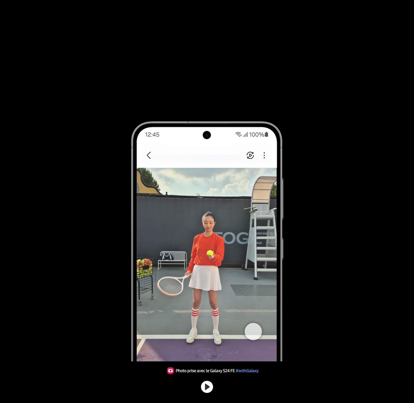 The video slows down as the tennis ball is hit. A circle at the bottom indicates where the Instant Slow-mo effect is applied when the phone is touched. Text reads Captured by Galaxy S24 FE #withGalaxy