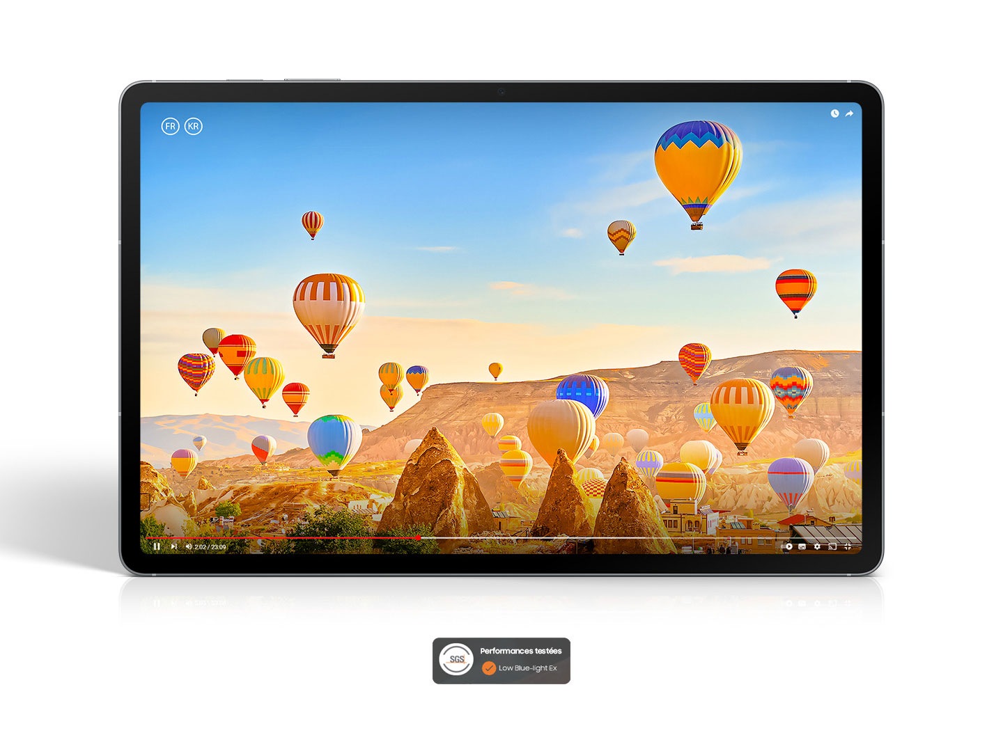 A video of colorful hot air balloons flying over a desert landscape is playing on the screen of Galaxy Tab S10 FE+ showcasing the bright, vibrant picture on the display. SGS Performance Tested Low Blue-light Ex logo shown.