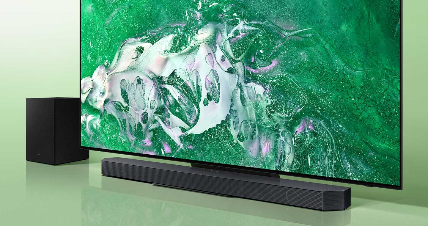 A big-screen TV with a Soundbar and subwoofer.