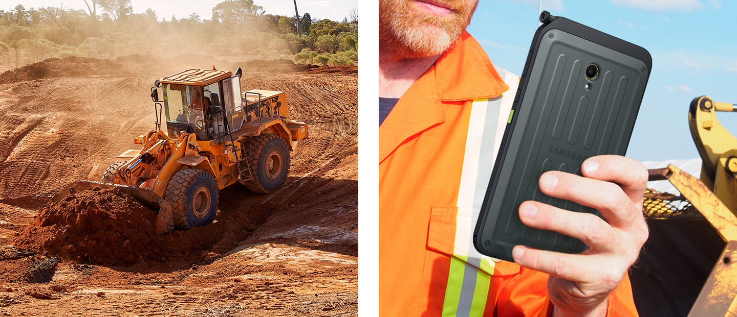 一部輪式挖掘機在廣闊的土地上挖掘土壤。在建築工地上，一名男性工人單手拿著 Galaxy Tab Active5 5G 裝置。