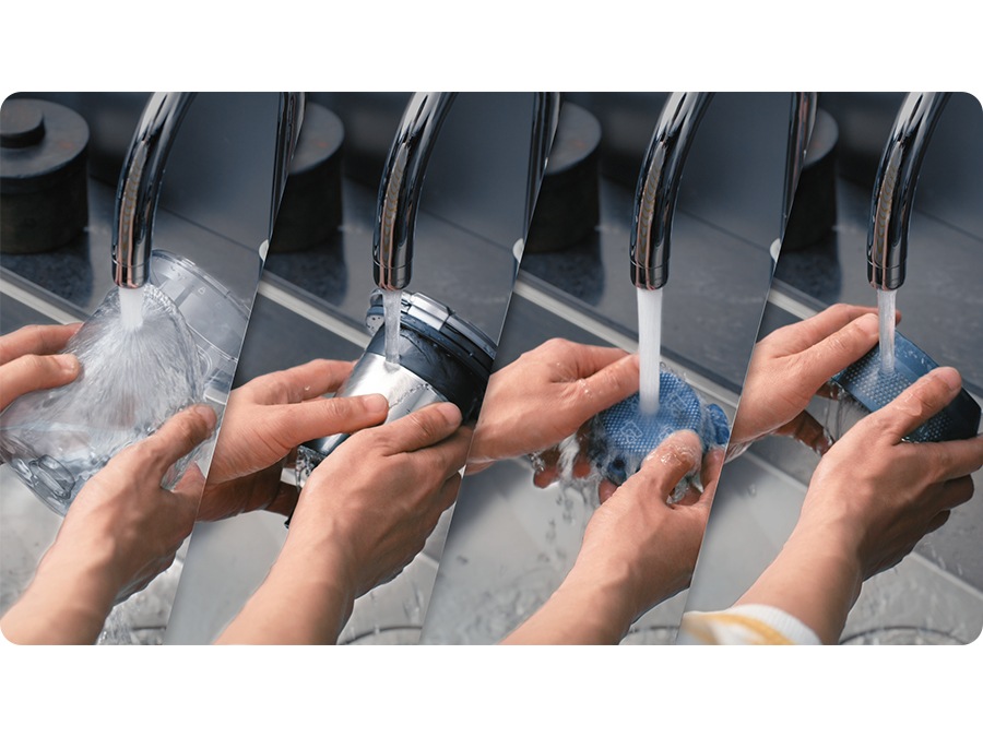 A Jet 85's 4 Dustbin parts get handwashed under a tap. The 4 parts are the Dustbin, Cyclone, Micro Filter, and Fine Dust Filter.