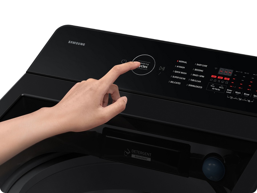 A person is controlling the rear control panel.