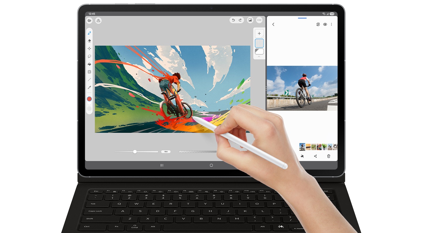 A person uses Gallery app on Galaxy Tab S10 FE+ with Book Cover Keyboard attached to refer to an image of a bicycle and sketches an image of a boy cycling on a road using S Pen in Clip Studio Paint app.