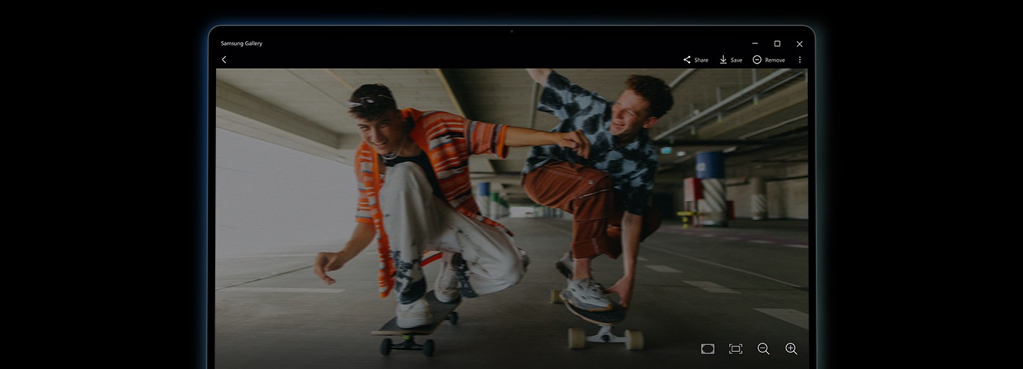 An image of two young men on skateboards is open in Samsung Gallery app on Galaxy Book5 360 before being remastered using the NPU-powered Photo Remaster tool. The image is blurry and low-quality.