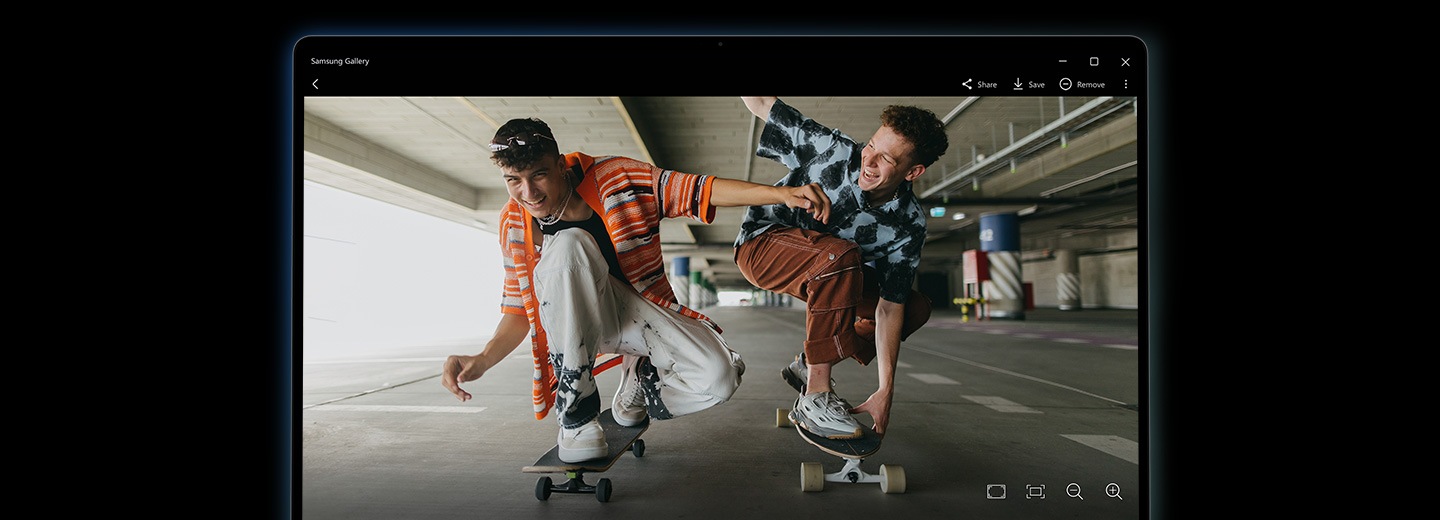 An image of two young men on skateboards is open in Samsung Gallery app on Galaxy Book5 360 after being remastered using the NPU-powered Photo Remaster tool. The image is bright with sharp details and enhanced quality.