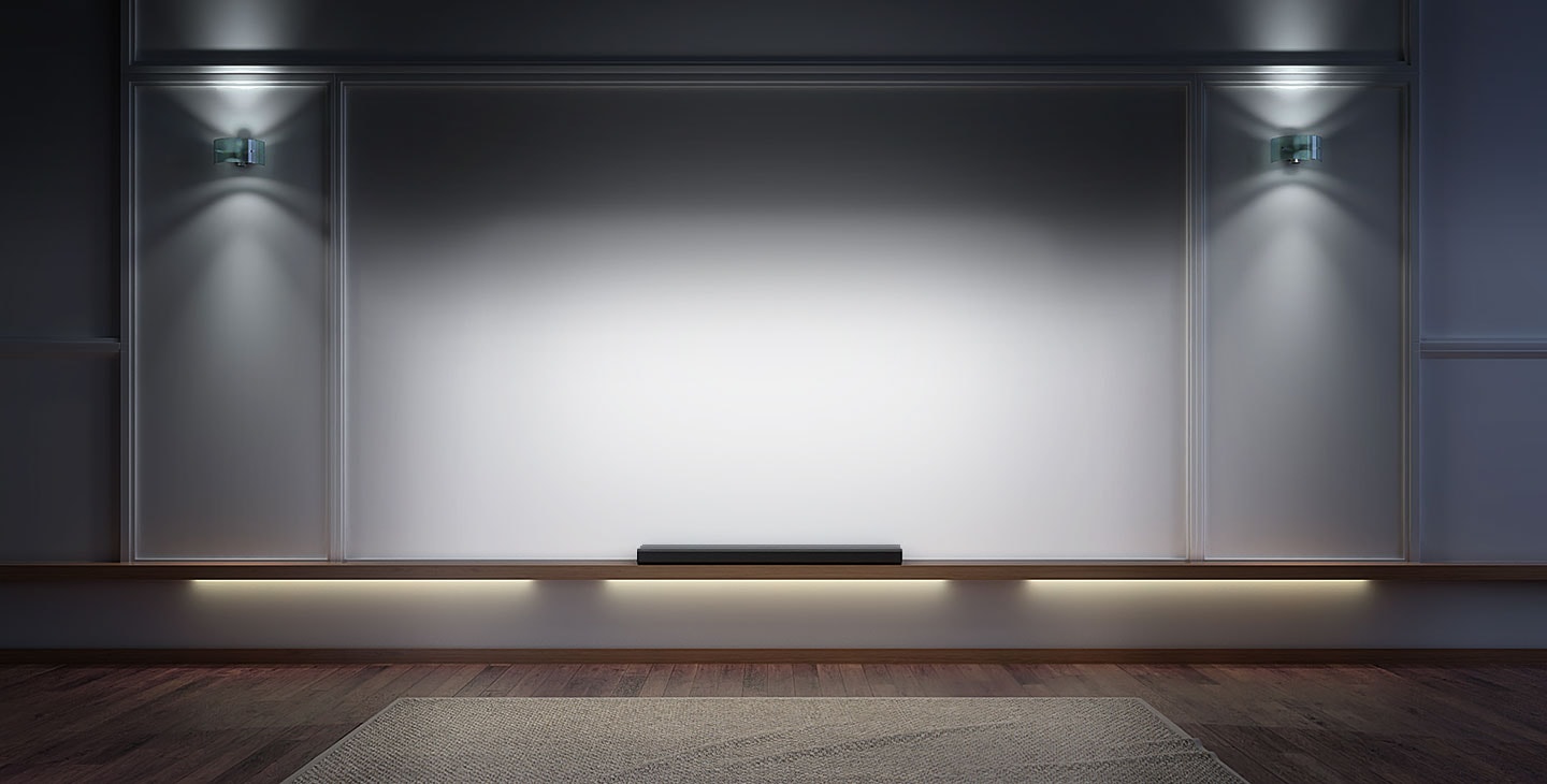 A Dimly-lit entertainment room with TV screen, a projector and two lounge chairs facing each other.
