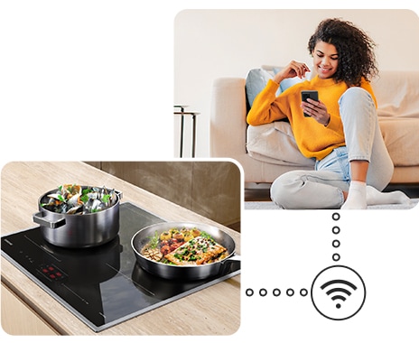Two pots with delicious food are boiling on the cooktop, and a woman is monitoring the cooktop status remotely near the sofa via the SmartThings app on her smartphone.