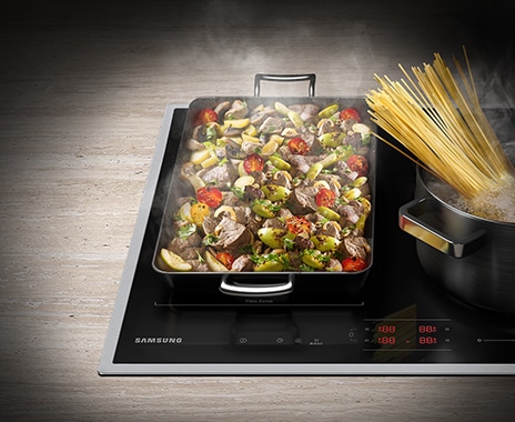 Beef stir-fry is grilling on a large rectangular grill pan at the Flex Zone. On the right side of flex Zone, spaghetti in a pot is boiling.