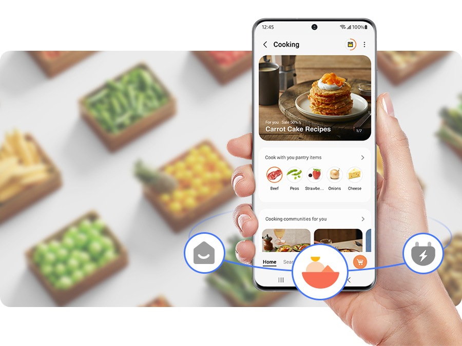 Osoba koristi mobilnu aplikaciju SmartThings za kuhanje.