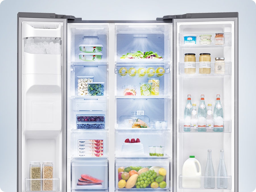 A refrigerator filled with various foods is open. Cool air comes out through vents in each compartment to maintain the optimum temperature for the food to stay fresh.