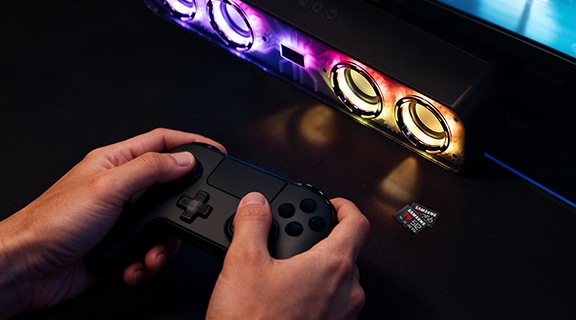 A hand playing a game on the console