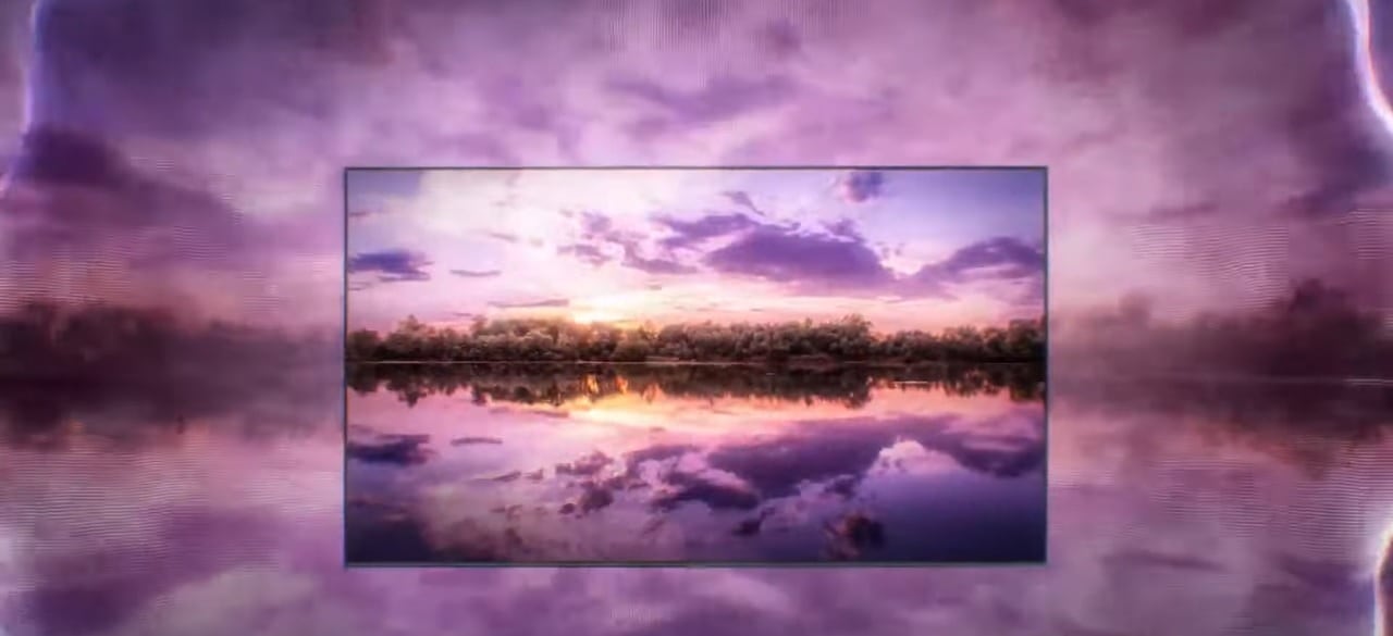 A QLED TV is on display with a nature scene on its screen. 
