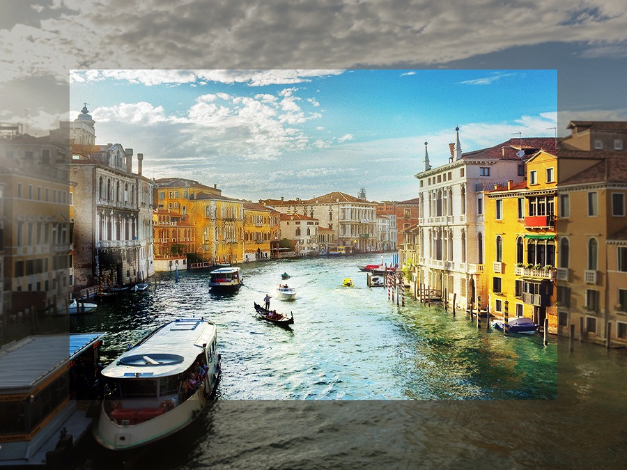 La couleur du canal et des bâtiments au centre apparaît plus naturelle et détaillée par rapport aux bords via Contrast Enhancer.
