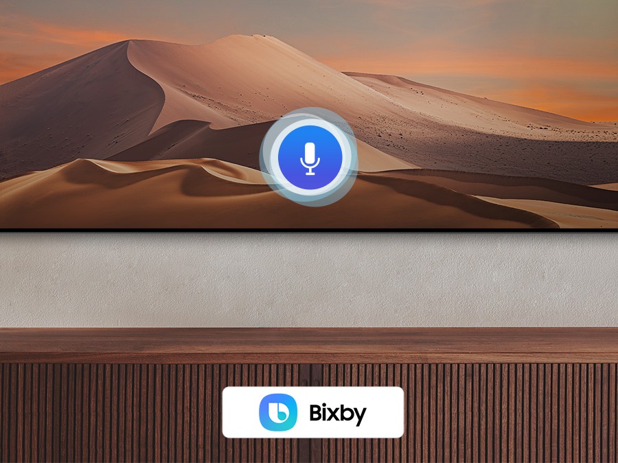 Une icône de microphone recouvre une image, illustrant la fonction d'assistant vocal. Les logos Bixby, Alexa intégré et OK Google sont affichés en bas.