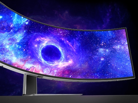 The monitor shows a black hole in space on the screen.