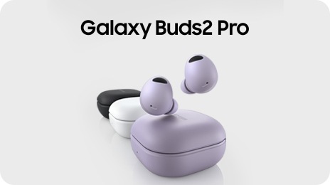 Three Galaxy Buds2 Pro devices are lined up. The Bora Purple Galaxy Buds2 Pro device in the front has two earbuds hovering over the closed case. The closed White case in the middle is followed by the closed Graphite case.