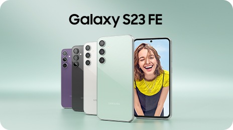 Five Galaxy S23 FE devices in Purple, Graphite, Cream and Mint. Four are seen standing upright from the rear overlapping on top of each other. The other one is seen from the front with a woman up-close onscreen smiling at the camera.